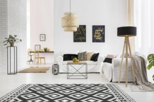A living room with white walls and black accents.